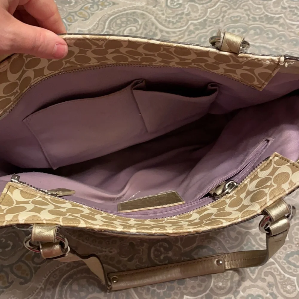Gold coach purse with lavender inside